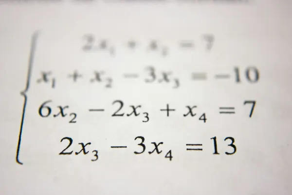 A system of linear equations printed on white paper.