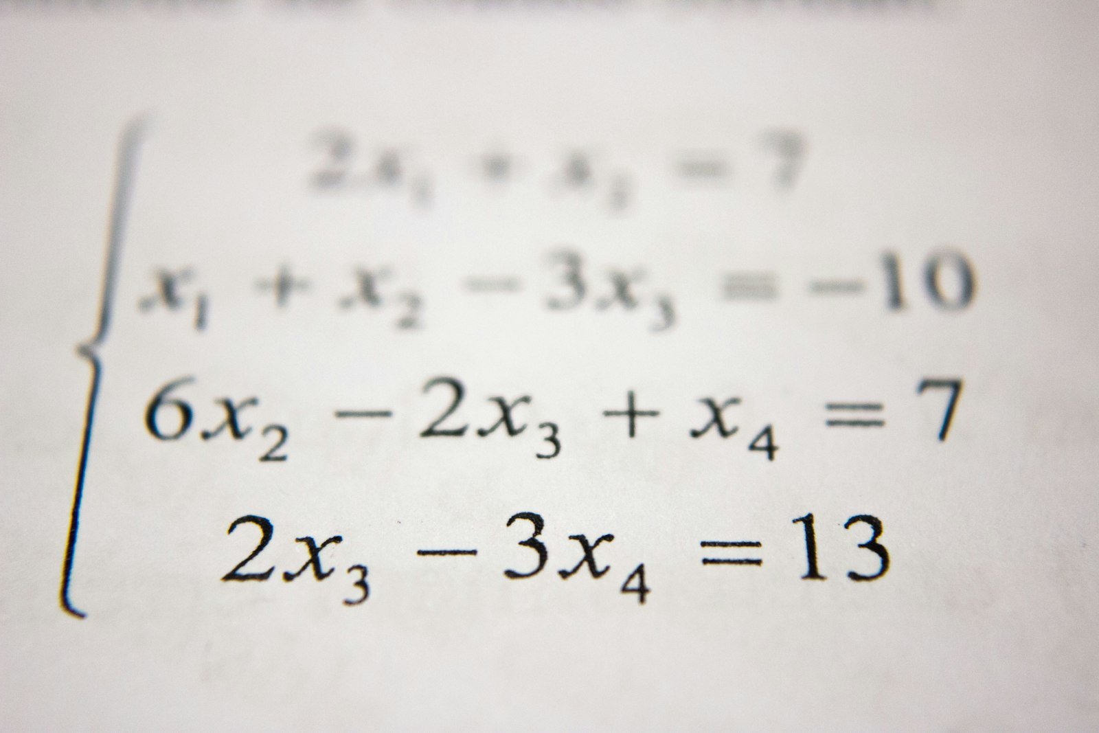 A system of linear equations printed on white paper.